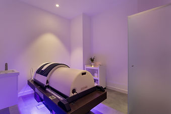 Iyashi Dome infrared therapy treatment in a softly lit wellness room
