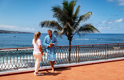 Couple walking on the seafront terrace at Océano Health Spa Hotel Tenerife