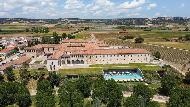 Castilla Termal Monasterio de Valbuena aerial view with outdoor pool and vineyards in Ribera del Duero