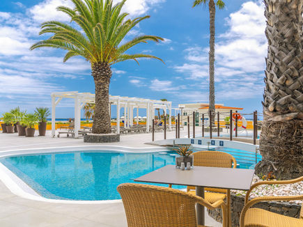 Outdoor swimming pool at Ondamar hotel within Galo Resort Madeira