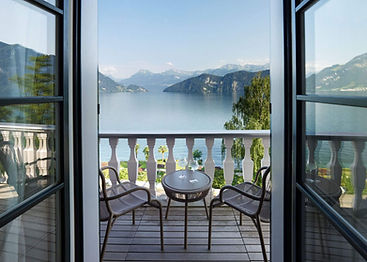 Balcony seating at Chenot Palace Weggis with lake views through large windows