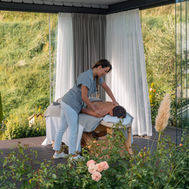 Outdoor massage therapy in the garden at Preidlhof wellness resort