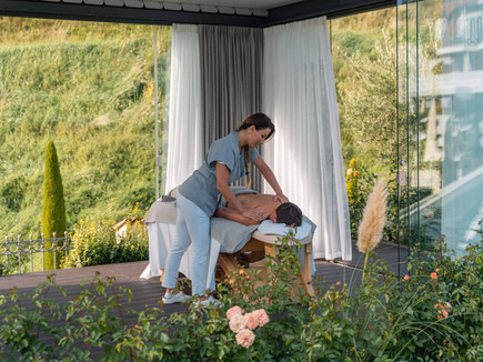 Outdoor garden massage at Preidlhof wellness retreat in Italy