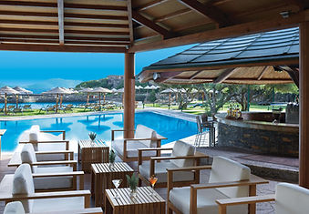 Poolside lounge and shaded bar at Porto Elounda Resort in Crete Greece