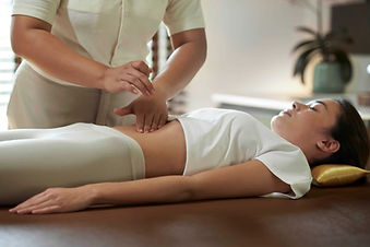 Abdominal massage therapy supporting digestion in the Gut and Immunity Support programme at RAKxa Integrative Wellness, Bangkok