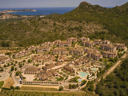 Aerial view of Cap Vermell Grand Hotel set into the hillside above the north-east coast of Mallorca