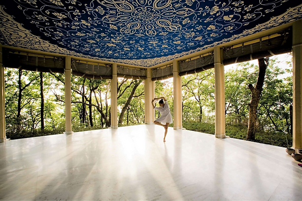 Yoga practice at Ananda in the Himalayas pavilion surrounded by forest