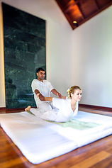 Ayurvedic therapist performing traditional massage at Shanti Maurice Spa Mauritius