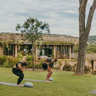 Outdoor yoga session on the lawn at Lily of the Valley Hotel