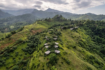 Aerial hilltop view of Santani Wellness Resort villas spread across lush green slopes