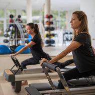 Fitness studio with Reformer Pilates equipment at Palasiet Thalasso Clinic Spain.