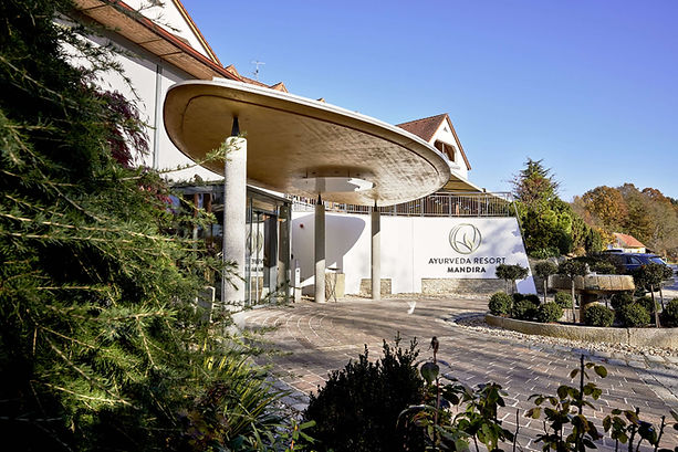 Ayurveda Resort Mandira entrance in Austria surrounded by greenery