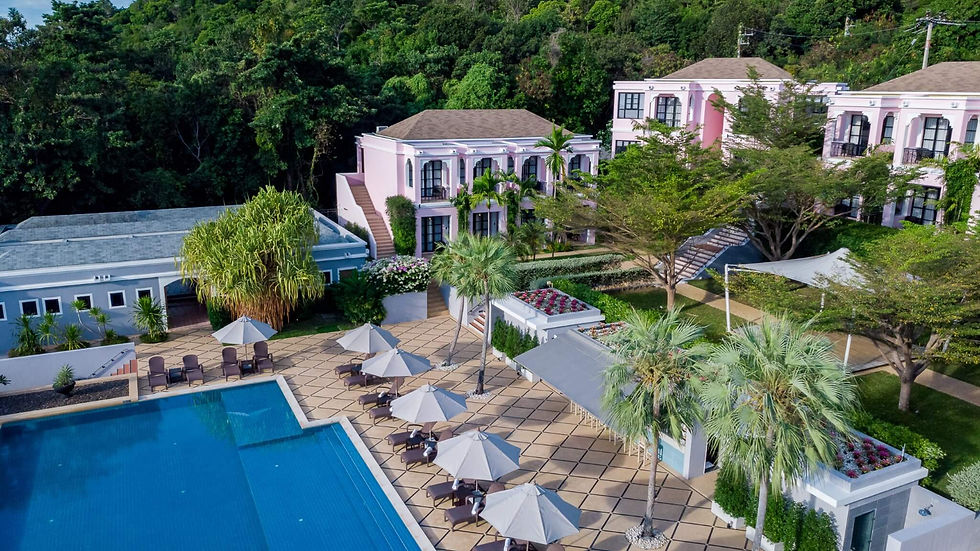 Aerial view of Absolute Sanctuary in Koh Samui featuring the pool, palm trees and wellness buildings.