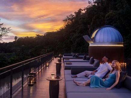 Couple stargazing at the observatory deck during sunset at Anantara Layan