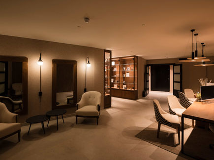 Wellness reception lounge with warm lighting at Castilla Termal Brihuega
