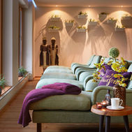 Indoor relaxation lounge with cosy seating at Ayurveda Resort Mandira Austria