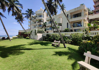 Garden and ocean view at Rockholm Ayurveda retreat on Lighthouse Beach, Kerala