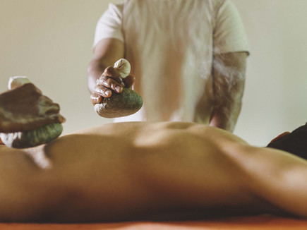 Traditional Ayurvedic herbal compress massage at Six Senses Vana wellness retreat in Dehradun, India.