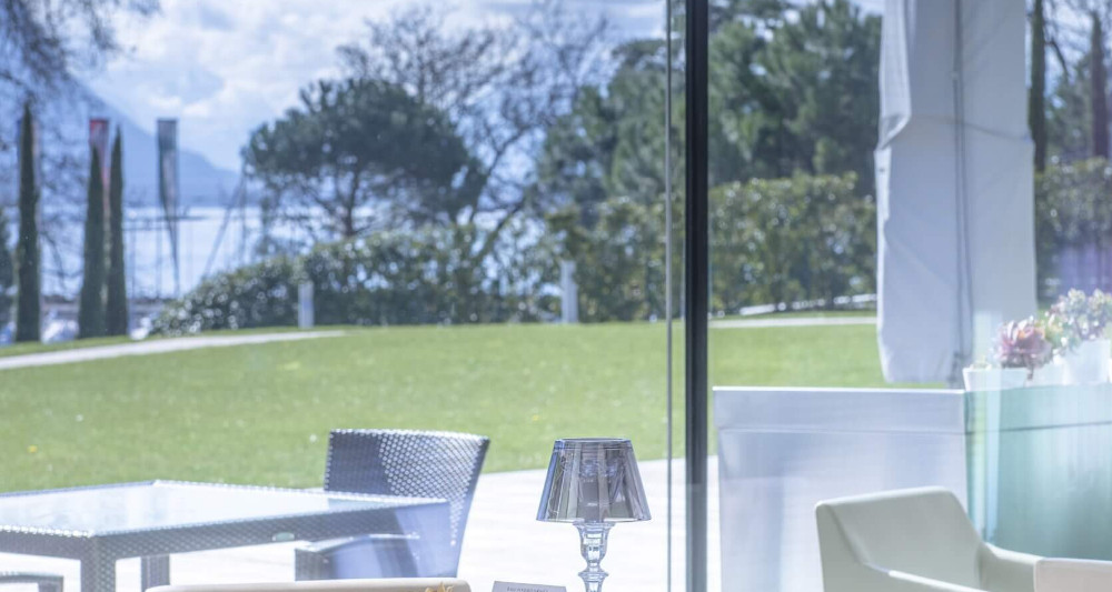 Bright indoor dining area with mountain views at Clinique La Prairie