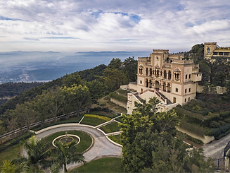 Aerial view of Ananda in the Himalayas palace building surrounded by lush greenery and mountain scenery