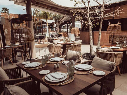 Kar-Bon restaurant at Domes Baobab Suites, with woven lanterns and open-air seating