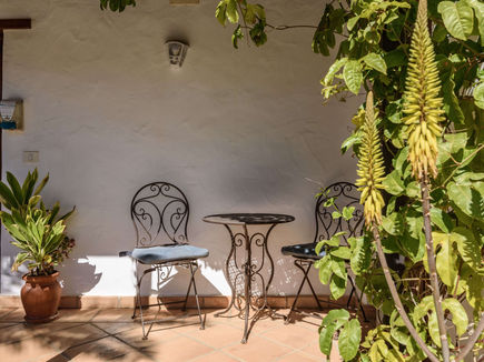 Shaded patio seating area with plants at Azulfit retreat in the Canary Islands