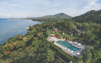 Tropical hillside retreat in Thailand overlooking the sea, designed for stress management and holistic wellbeing.