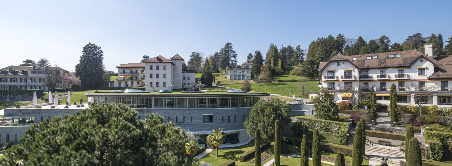 Overview of Clinique La Prairie property with gardens and wellness buildings