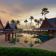Panoramic view of Chiva-Som’s pool and Thai-style pavilions at sunset