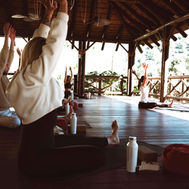 Yoga class on open-air wooden deck at Shanti-Som Wellbeing Retreat, Marbella