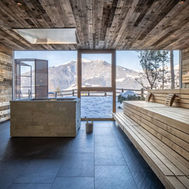 Wooden sauna interior with mountain views at My Arbor wellness hotel in Italy