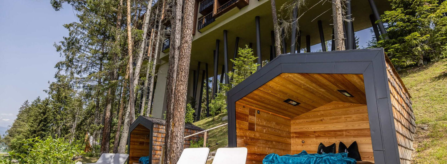 Outdoor spa cabanas and loungers at My Arbor luxury wellness hotel in Italy