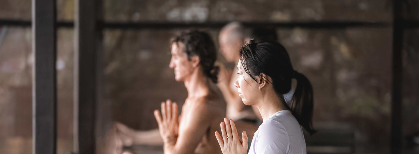 Meditation practice in peaceful yoga studio at Samahita Retreat Thailand