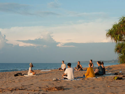 Sunrise beach yoga session at Sen Wellness Sanctuary Tangalle Sri Lanka