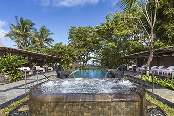 Hydrotherapy pool surrounded by tropical greenery at Shanti Maurice Spa Mauritius