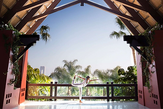 Yoga session on open-air balcony at Asia Gardens Hotel & Thai Spa