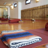 Yoga mats and blankets arranged in the bright studio at Azulfit Yoga & Pilates Retreat in Fuerteventura
