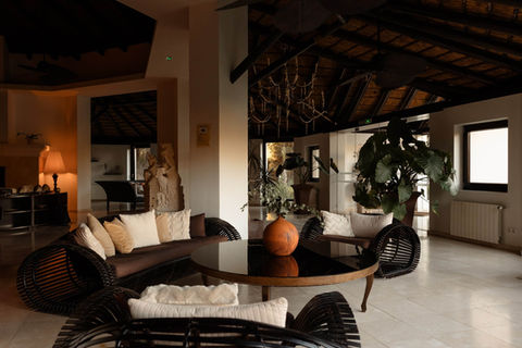 Shanti Som lounge area with rattan furniture and ambient lighting