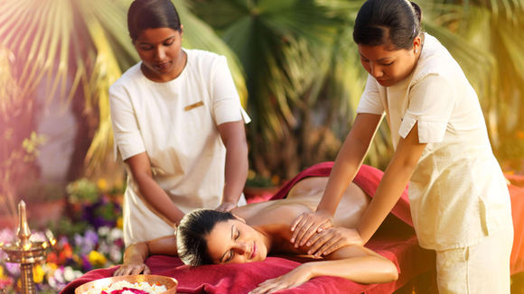 Outdoor Ayurvedic massage with two therapists at Ananda in the Himalayas