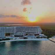 Aerial view of SHA Wellness Clinic Mexico at sunset between the lagoon and the Caribbean
