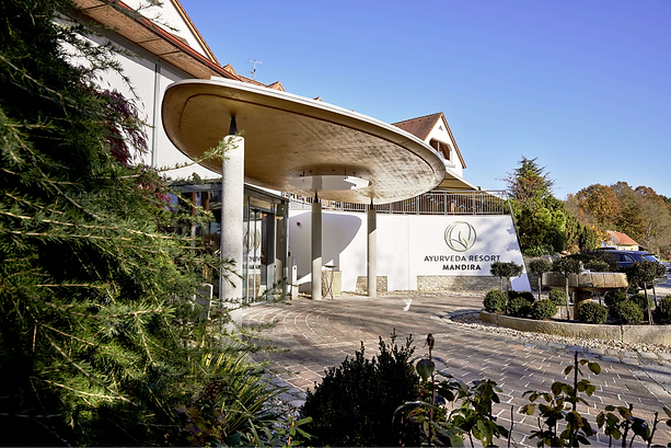 Ayurveda Resort Mandira entrance in Austria surrounded by greenery