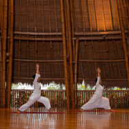 Yoga and meditation class inside bamboo pavilion at Fivelements Retreat Bali