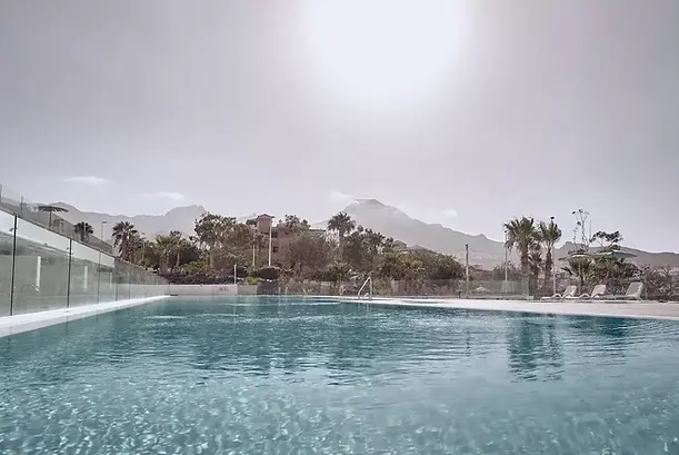 Infinity pool with mountain views at Baobab Suites Canary Islands