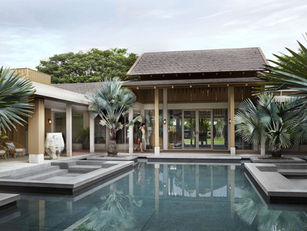RAKxa Integrative Wellness’s tranquil wooden pavilion surrounded by lush greenery and serene water features.