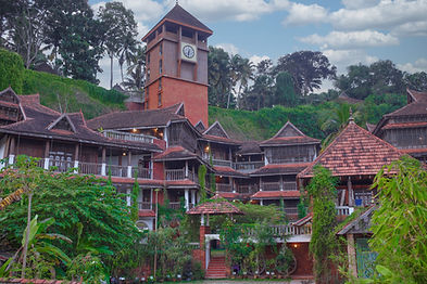 Panoramic view of Ayursoma Ayurveda Resort nestled in lush greenery in Kerala.