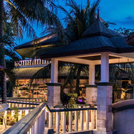 Outdoor dining terrace with tropical surroundings at Mangosteen Resort Phuket
