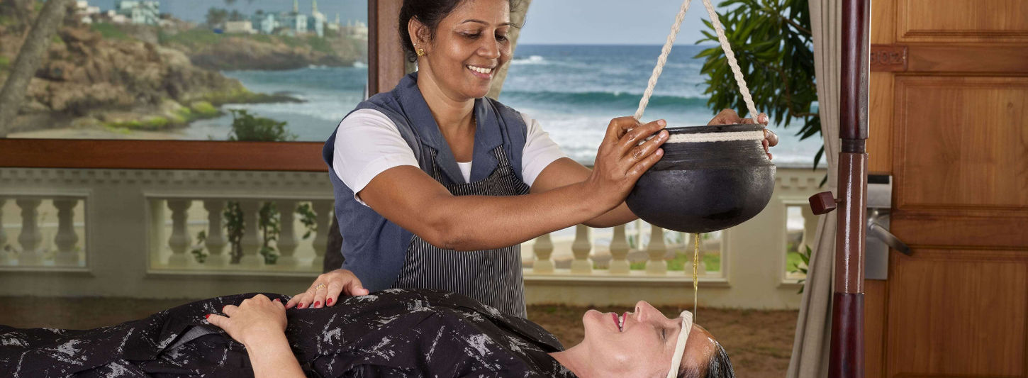 Shirodhara Ayurveda treatment at Rockholm retreat on Lighthouse Beach, Kerala