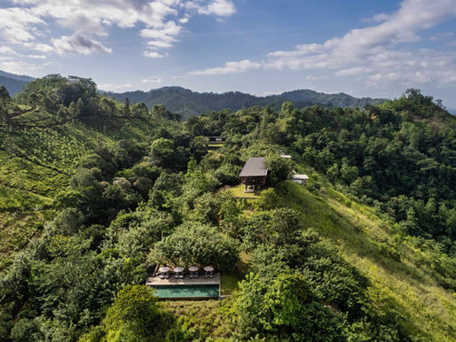 Panoramic aerial view of Santani Wellness Resort in Sri Lanka, showing garden chalets along mountain views and and lush landscape.