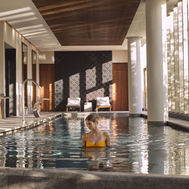 Guest in the indoor thermal pool at SHA Wellness Clinic Mexico