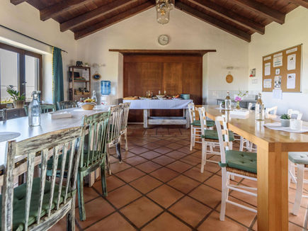 Communal dining room with rustic décor at Azulfit Retreat in the Canary Islands